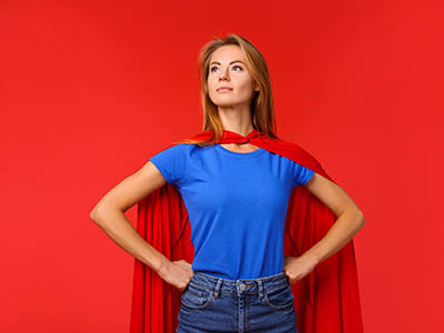Woman with cape as superhero